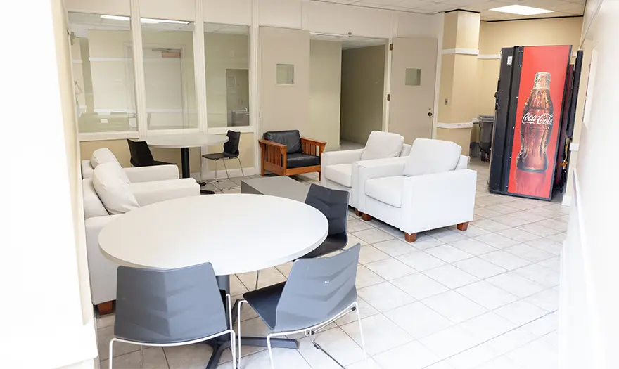 Parham West 1st floor laundry room seating area and vending machine