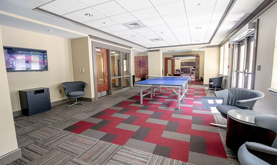 Presidential Village 2 community room with ping pong table