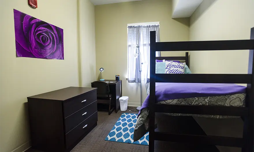 Presidential Village 2 suite bedroom that's decorated