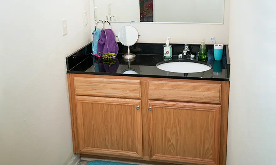 Decorated bathroom vanity and sink in a Ridgecrest East or West Suite